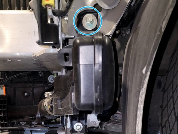 Use 10mm socket, extension, and ratchet to remove two (2) nuts shown