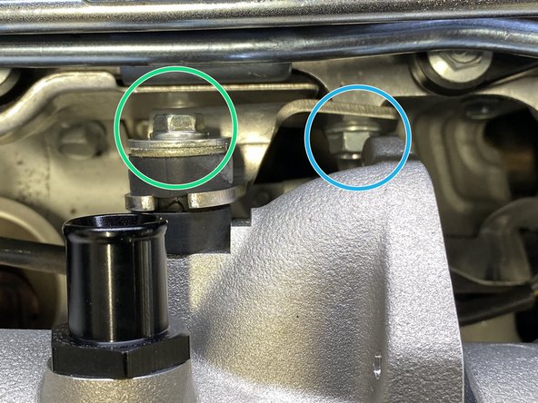 Hand thread the OE 12mm flange bolt through the bracket into the cylinder head