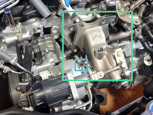 Place turbo over studs as shown