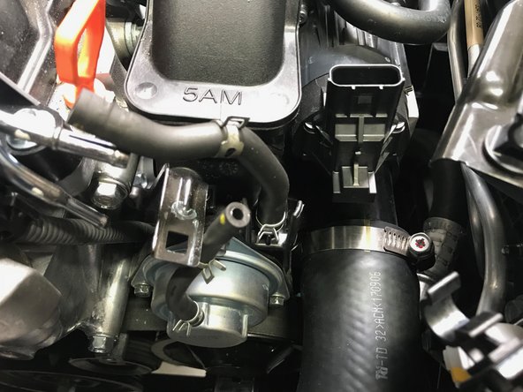 Pull the BPV hoses off the metal tubes in the direction of the orange arrows