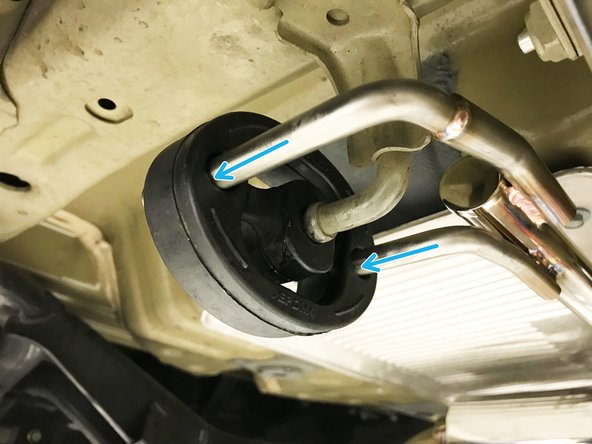 Then raise the rear end of the muffler section up and insert both rearward hangers