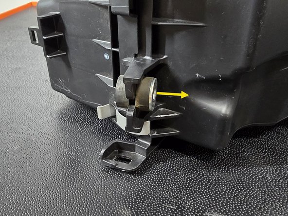 Remove the metal sleeve in the center of the rubber spacer as shown
