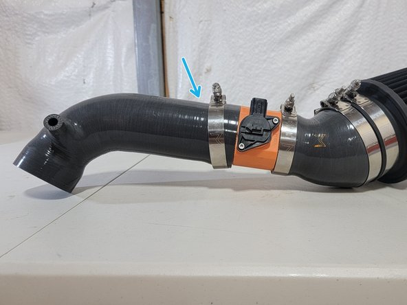 Gently install MAF Sensor into the 27Won MAF Housing as shown using the provided socket cap screws and a 3mm hex wrench or bit