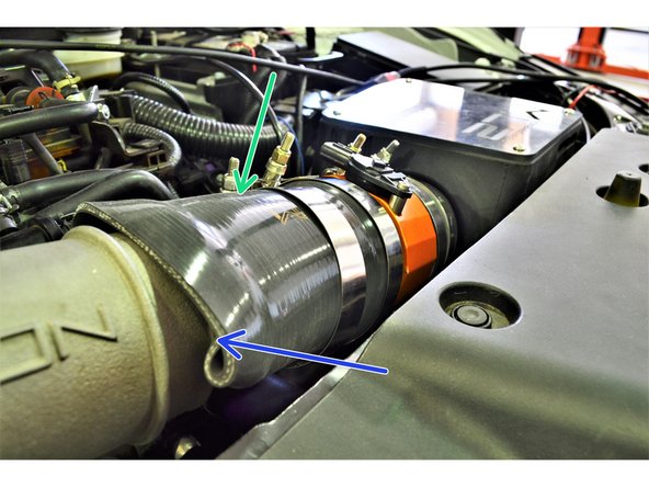 Verify the silicone coupler connecting to the airbox is over the circumference of the airbox outlet