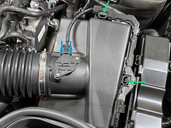 Use a 5.5mm socket and 3/8" ratchet or a small Phillips screwdriver to tighten the three intake clamps circled in yellow