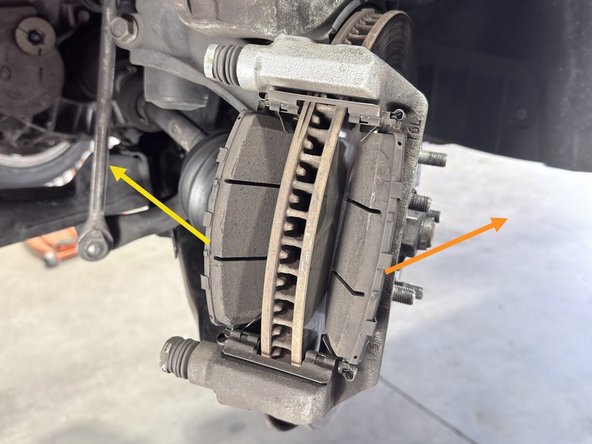 Remove the outer brake pad. This will come straight out to the side as shown