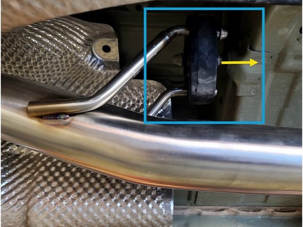 Using a spray cleaner, lubricate the rubber hanger