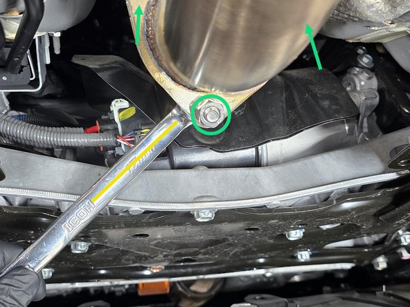 With the chassis brace removed, and a bent end wrench you can easily get a wrench on the back side of the exhaust hardware as shown
