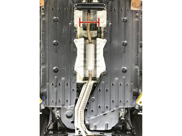 Support the exhaust mid-section with a jack stand, bungy, or second set of hands  before the next step