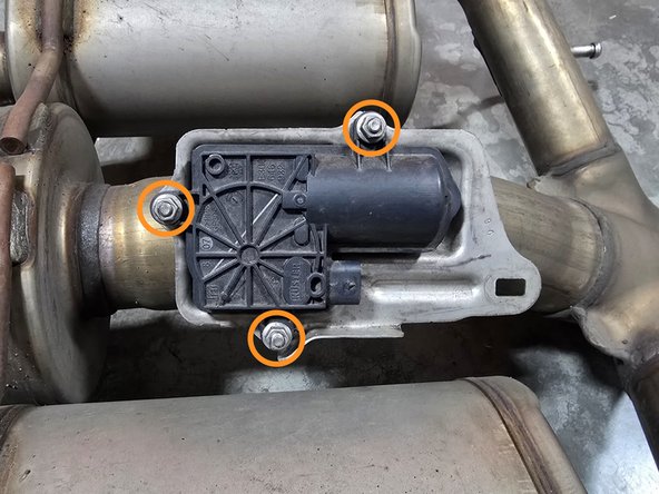 Use a 8mm socket to remove the (3) nuts securing the OE valve motor