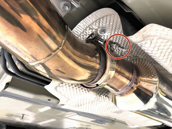 Next tighten the forward mid-section to rear mid-section v-band clamp using a 10mm socket and ratchet. Torque to 8-12 lb-ft