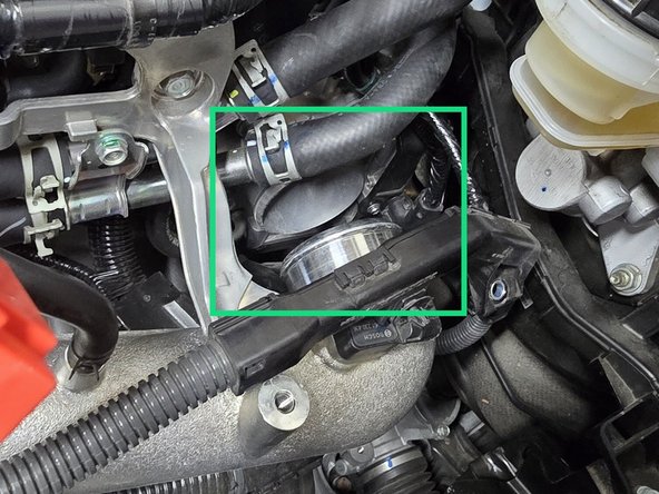 With the cold pipe out of the way, remove the OEM silicone as shown