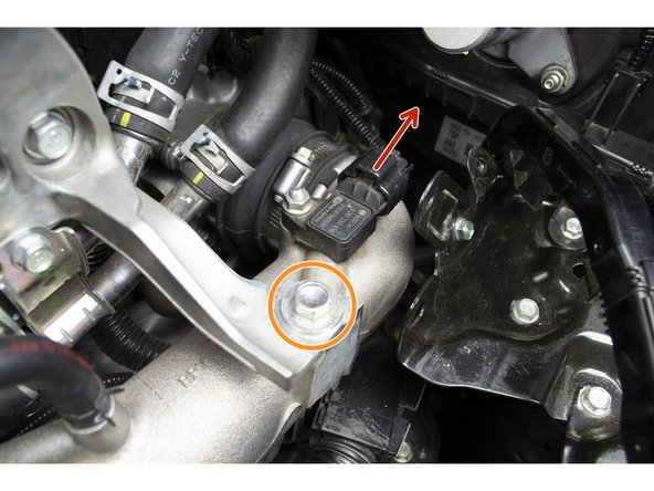 With a 12mm socket and ratchet remove the two (2) bolts, circled in orange, and set them aside