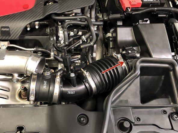 Reinstall the OEM intake tube by first sliding it on the airbox