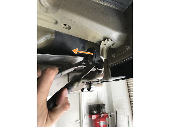 Pull the dual rod rubber hangers off the exhaust hanger rods; the rubber hangers will stay on the vehicle