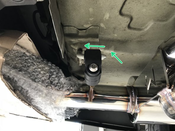 Then raise the rear end of the muffler section up and insert both rearward hangers