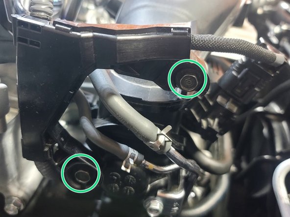 Reinstall both OE bolts into wiring loom with 10mm socket and ratchet