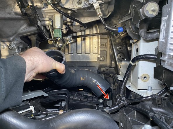 Place the silicone coupler over the intercooler outlet as shown