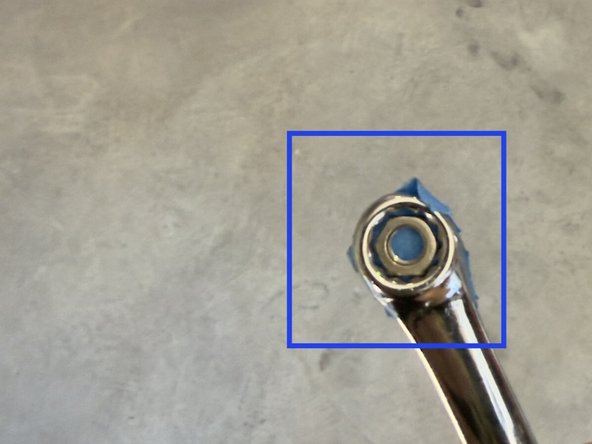 Setup your fastening nut as shown. A small piece of blue tape mounted to the backside of your wrench will help secure your nut while you tighten