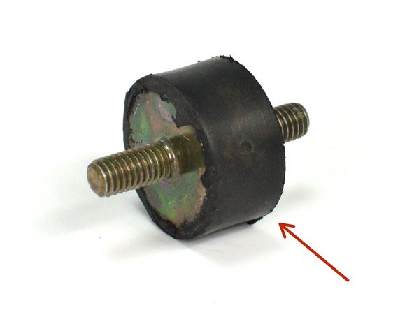 Locate the provided rubber isolator standoff for step 15