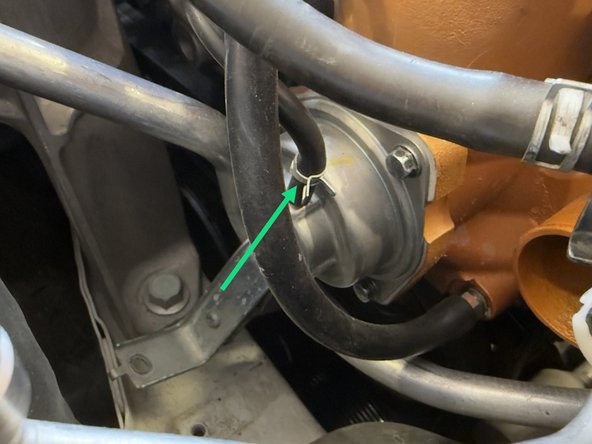 Using pliers, remove spring clamp from vacuum line leading to the BPV by sliding it up. Then disconnect the line from the OEM BPV by pulling up on it