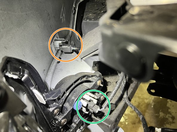 Use a Flashlight to see behind the driver side bumper that is loosely hanging off the car