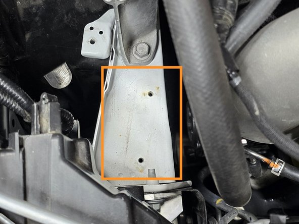 Remove the OE bracket from the engine bay as shown. The bolts will be reused. The bracket will not be reused
