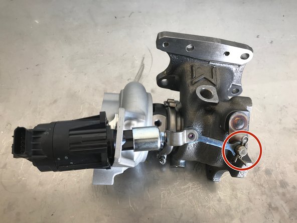 Install the WGA through the compressor housing and attach the WGA rod to the waste gate arm