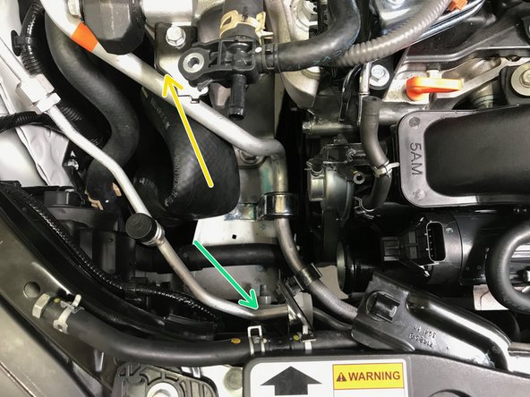 Pull the hose off the TIP in the direction of the arrow