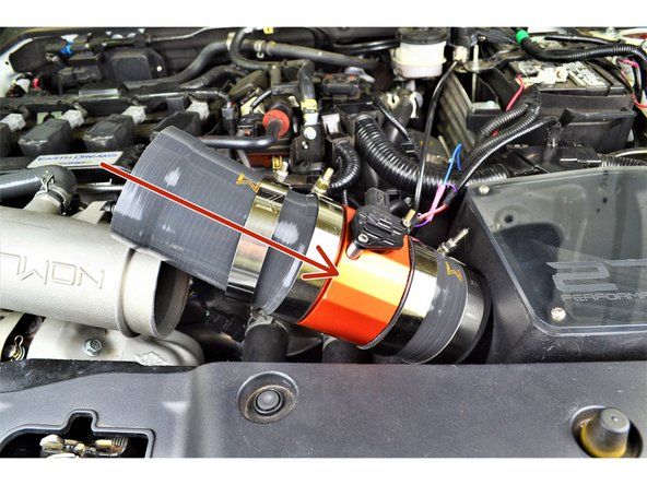 Angle the Race MAF &amp; Silicone Assembly into the engine bay and onto the airbox as shown