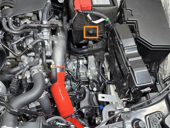 The battery bracket will mount in the location shown