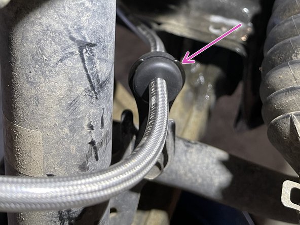 Install brake line into the provided brake line bracket. Lubricate the grommet if needed