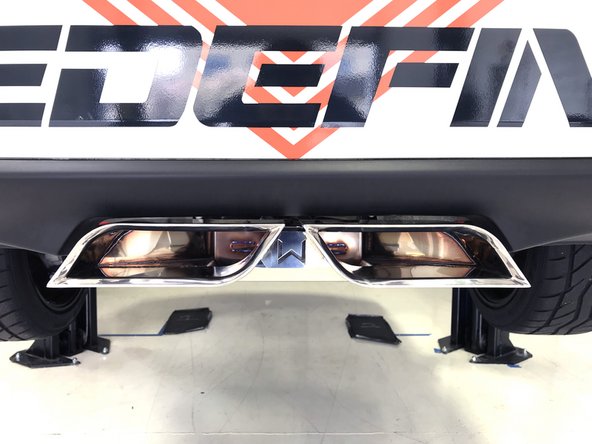 Stand back from the car and verify that the tips are centered and have 1/4-1/3 inch clearance from the bumper
