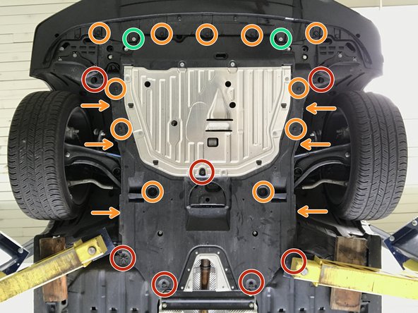 Install the seventeen (17) plastic push-clips. Orange arrows identify the push-clips described in the next step