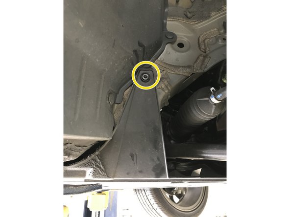 The images in this step show the push clips on the side of the under tray. These are labeled with the arrows in the previous step