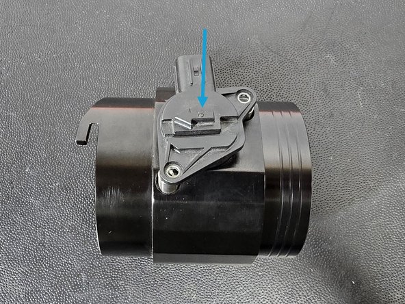 Rotate the MAF sensor back and forth to remove it from the OE airbox