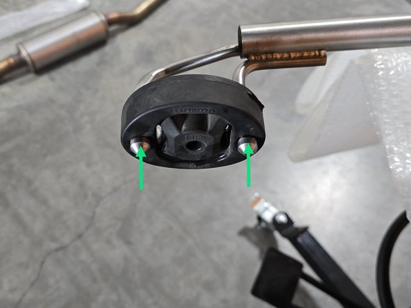 Use tongue &amp; groove pliers to press the rod out of the rubber hanger, remove the hangers from the studs on the chassis as shown