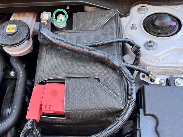 Use 10mm deep socket and ratchet to loosen  the10mm nut on top of negative battery terminal and pull off the terminal