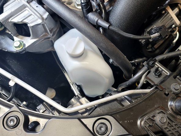 Place coolant reservoir back to its original position
