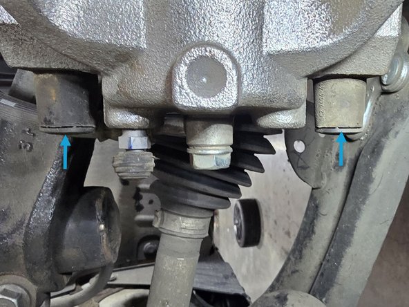 Using a 7mm Allen head socket and a 3/8" ratchet, reinstall the caliper slider bolts as shown and torque to 25 Ft/lbs