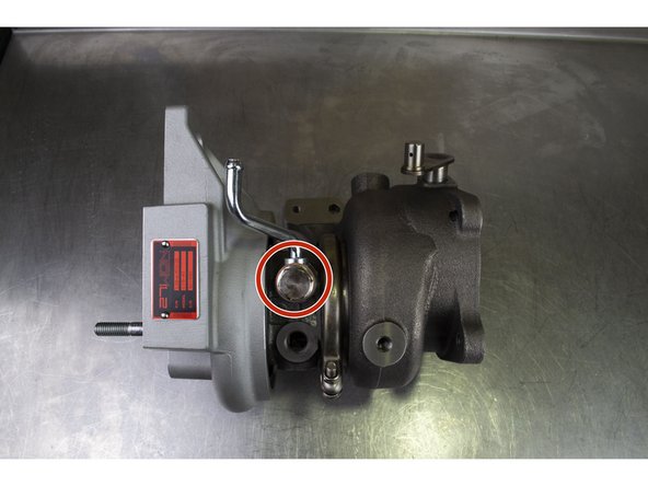 Install the upper coolant pipe on the turbo as shown.  Torque to 32-36 ft-lbs