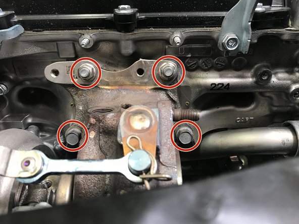 Use a 14mm socket, extension, &amp; ratchet  to remove the two (2) nuts and two (2) bolts holding the turbo to the engine