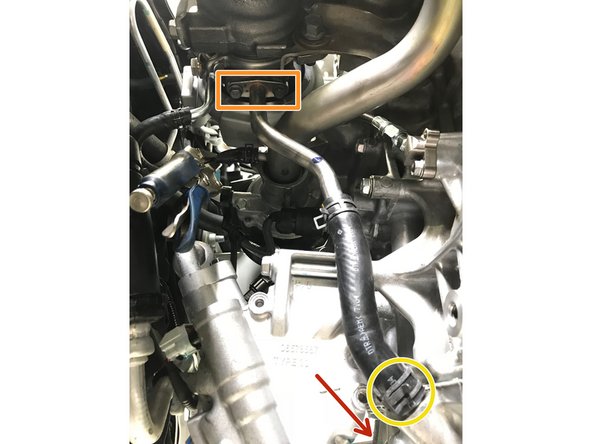 Locate the OE oil drain pipe and OE oil drain pipe gasket