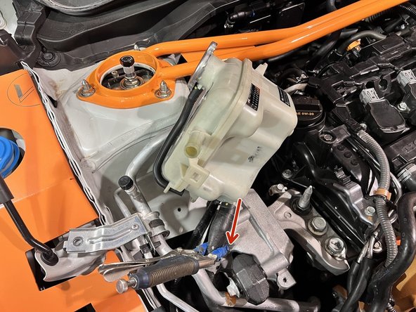 Using a slight twist and pulling motion at the same time pull the hoses off the coolant tank until each one pops off