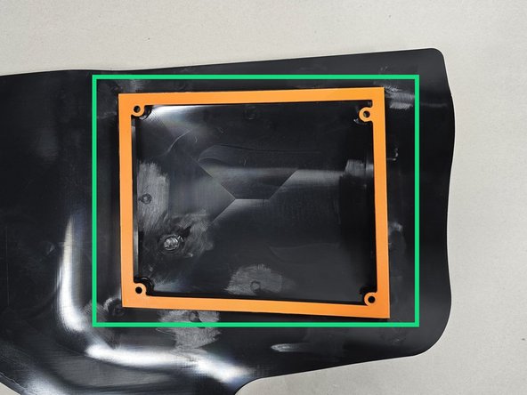 Line up the gasket on the bottom side of the airbox shroud as shown