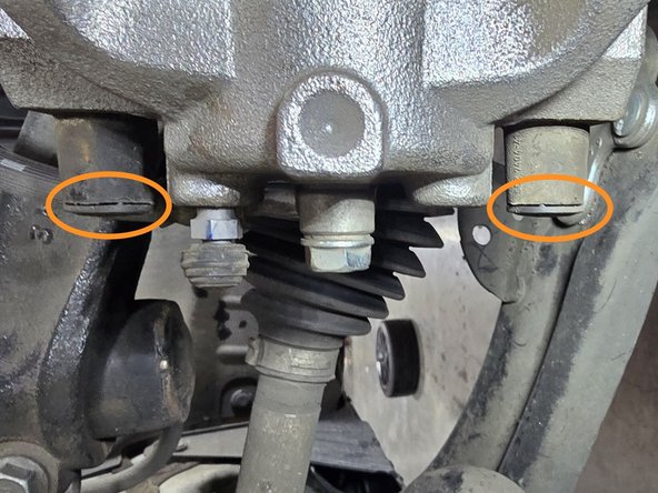 Move to the back side of the caliper for the removal process