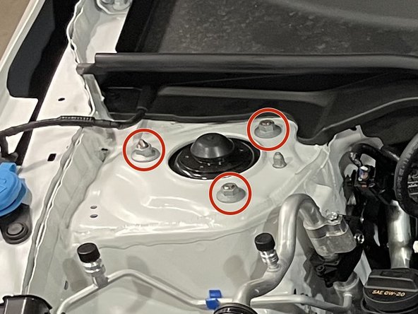 If you have an aftermarket suspension that could move when undone, be sure to note where it is located prior to the removal of the hardware. Failure to do so could change the alignment of your vehicle when reinstalling the strut hardware