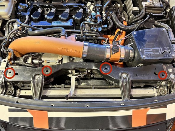 Locate the 4x 10mm holes shown in red circles. This is where we will install the supplied Riv Nuts