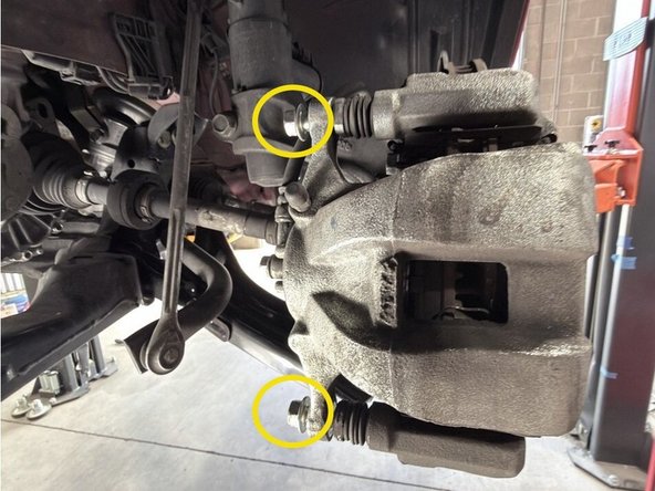 Move to the back side of the caliper for the removal process