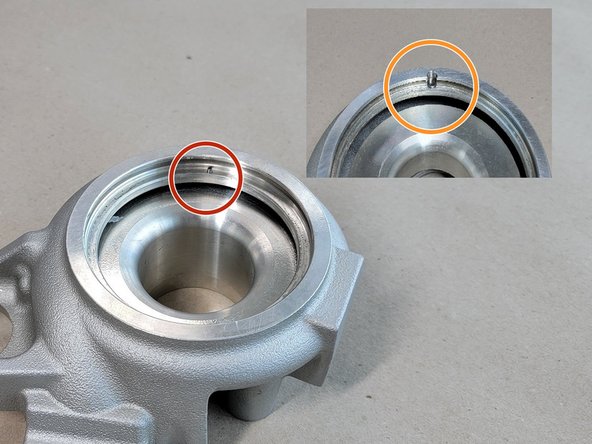 This is the only diference between a W1 and W2 CHRA installation, note the larger pin on the cover, and the divot on the CHRA